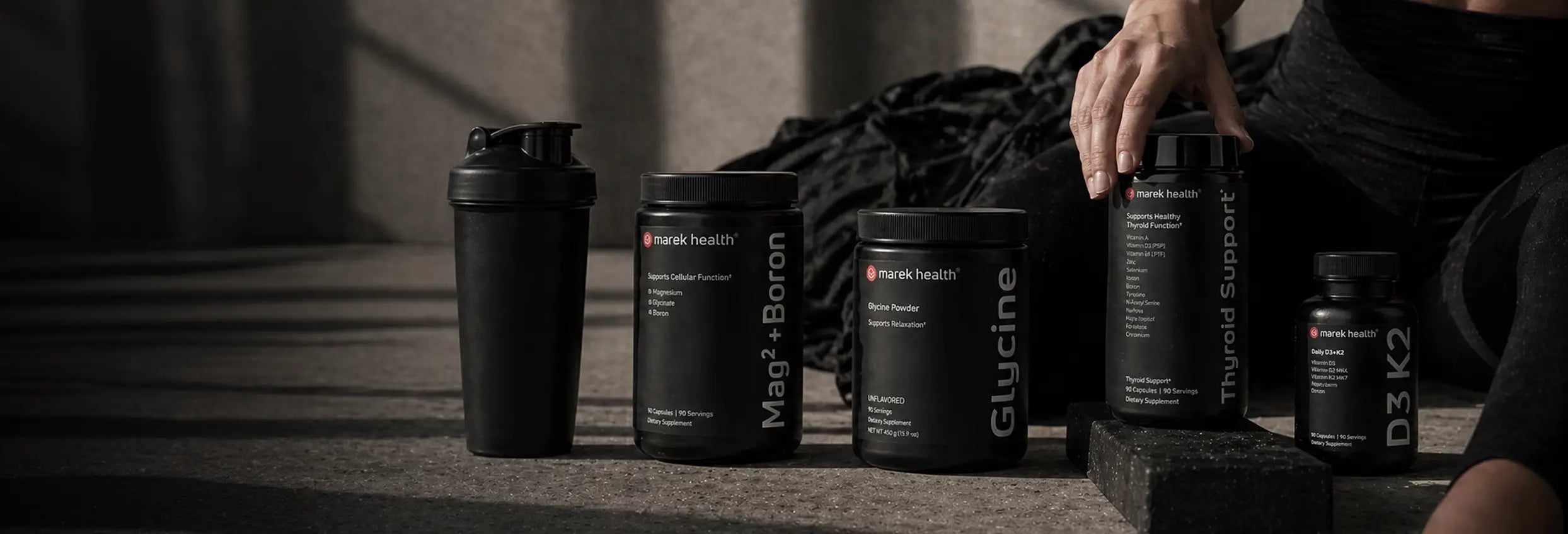 Marek Health supplement bundle featuring Mag2+Boron, Glycine Powder, Thyroid Support, D3+K2 bottles and shaker